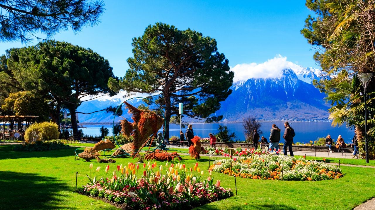 Montreux lakeside promenade on Lake Geneva with spring flowers and mountain views