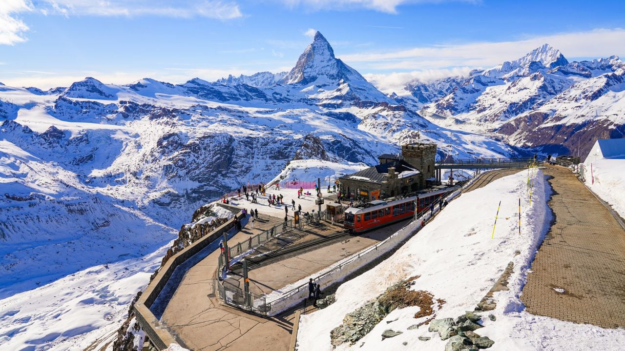 Gornergrat Railway train station at the summit with views toward the Matterhorn above Zermatt