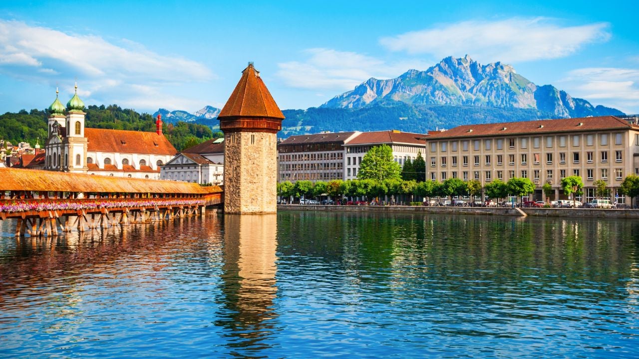 Kapellbrucke or Chapel Bridge is a wooden footbridge spanning Reuss river and Wasserturm water tower in Lucerne city, central Switzerland
