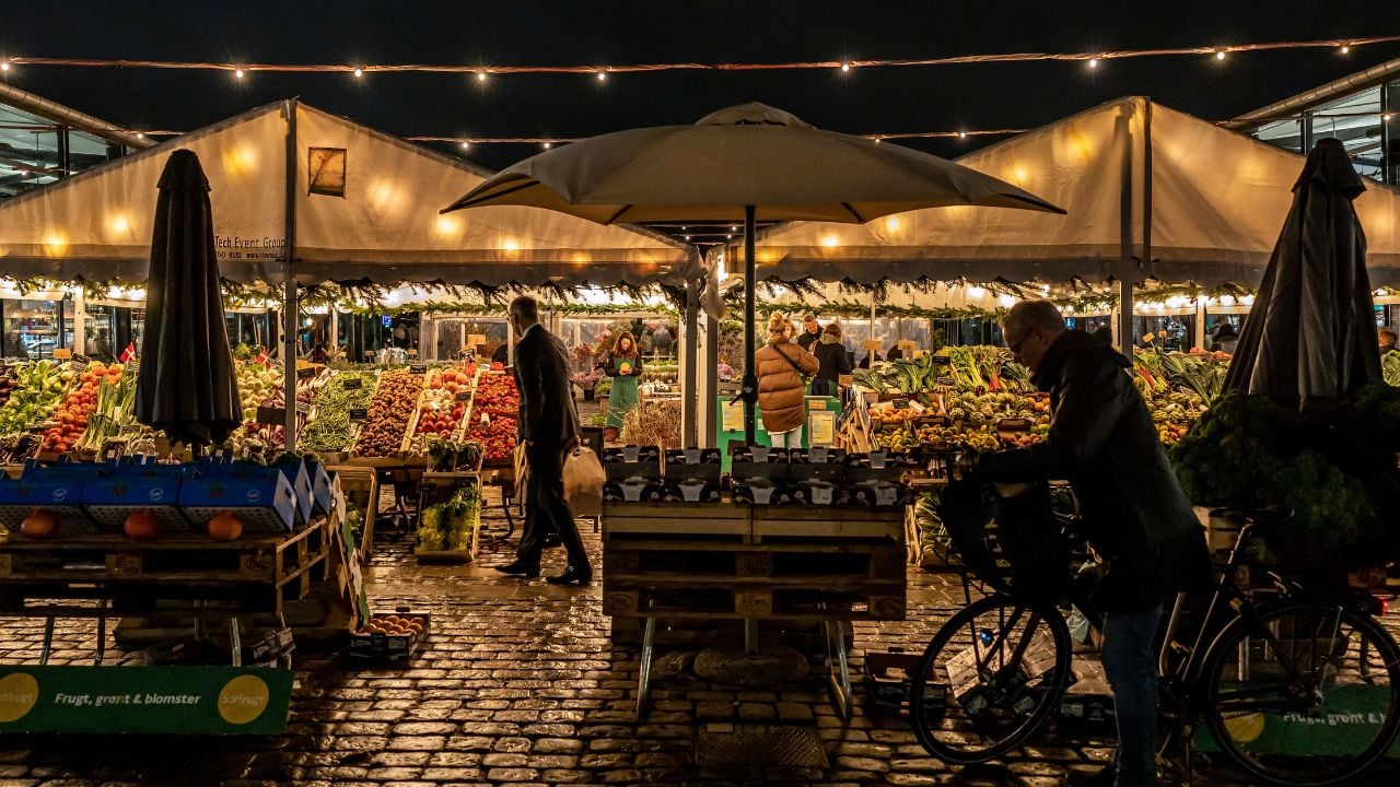 Cyclist near Torvehallerne food market in Copenhagen, Denmark