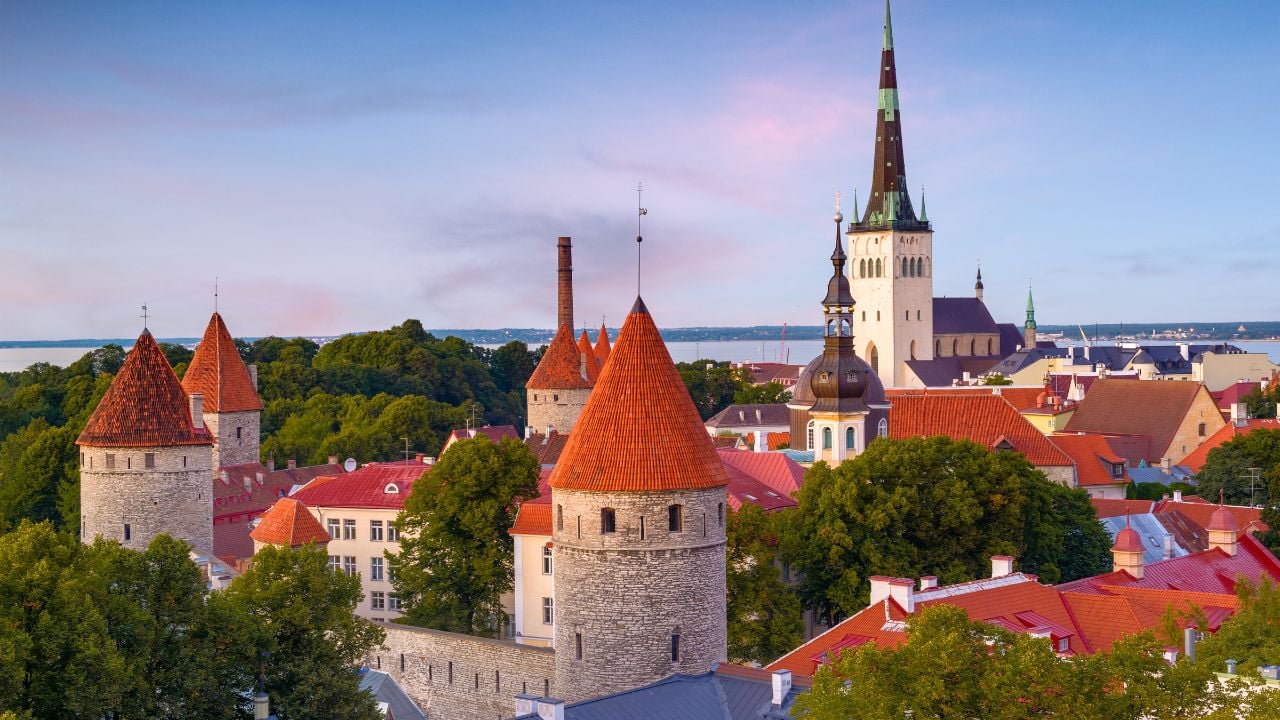Tallinn, Estonia historic skyline at dusk.