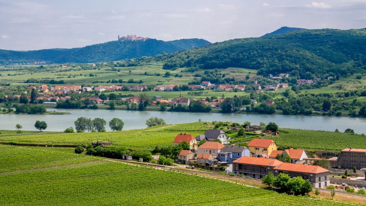 Wachau valley, Austria - 05.05.2025: Small town in the Wachau Valley along the Danube River with vineyards, historic buildings, and surrounding hills in Austria. Rural settlement within a cultural landscape, wine region, European travel destination, traditional architecture, and river valley environment