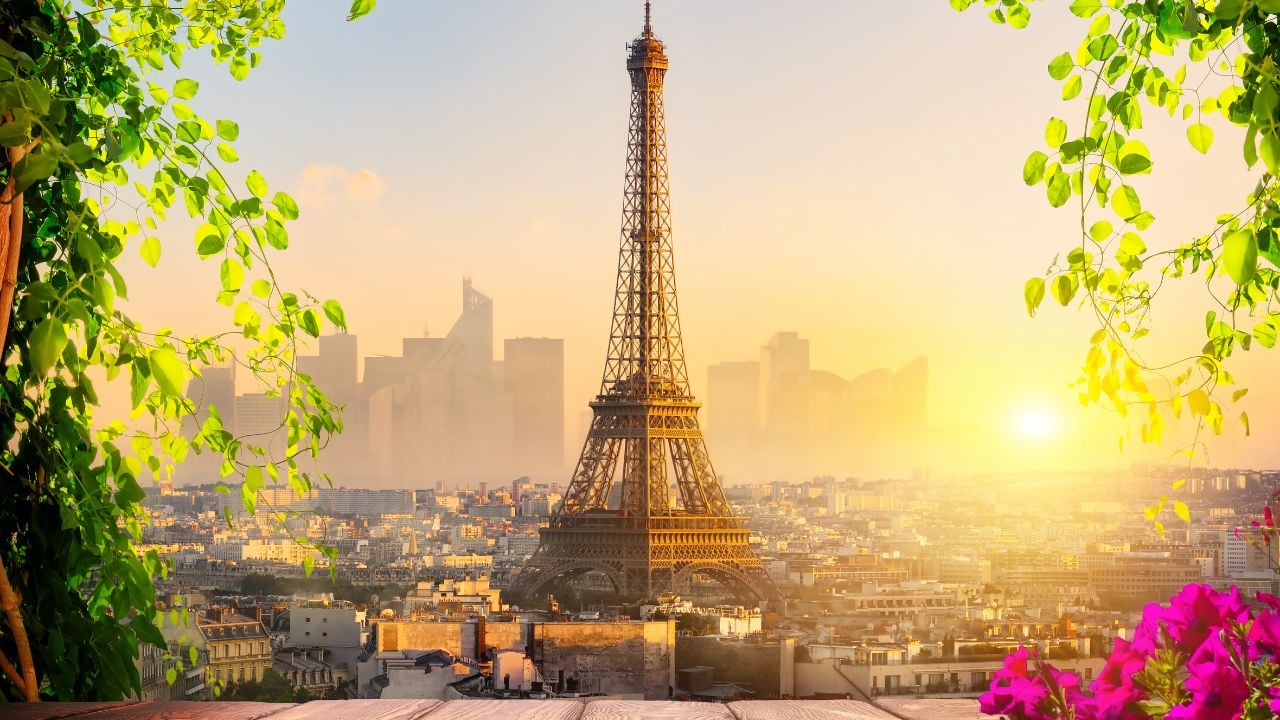 Parisian cityscape with the view on Eiffel Tower at sunset, France
