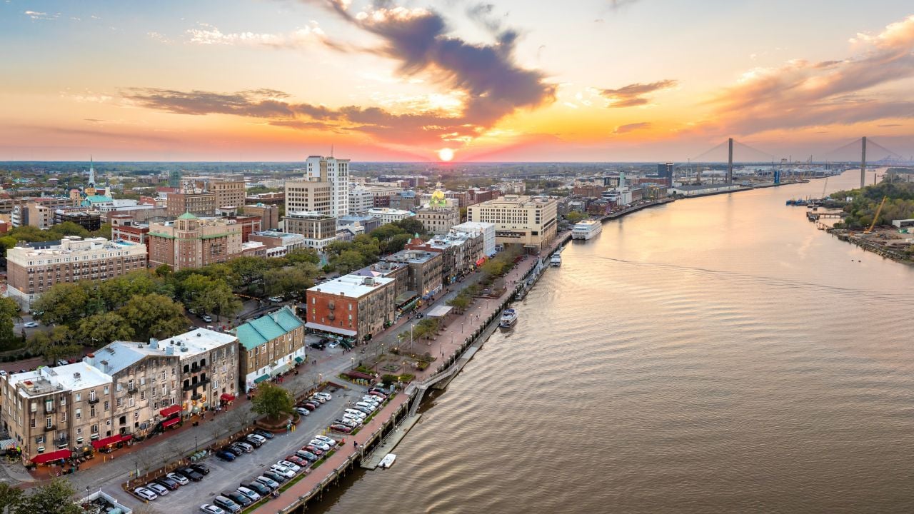 Waterfront River Street in Savannah, Georgia. Historic American architecture of old historical city. USA Southern cityscape at sunset