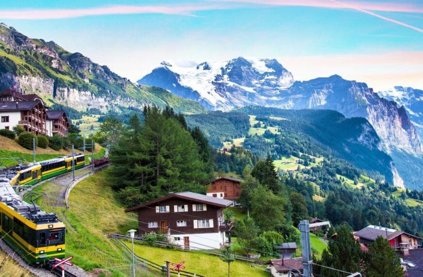 Beautiful mountain landscape with train in canyon of the city Lauterbrunnen in the Swiss Alps, Switzerland. Amazing places.
