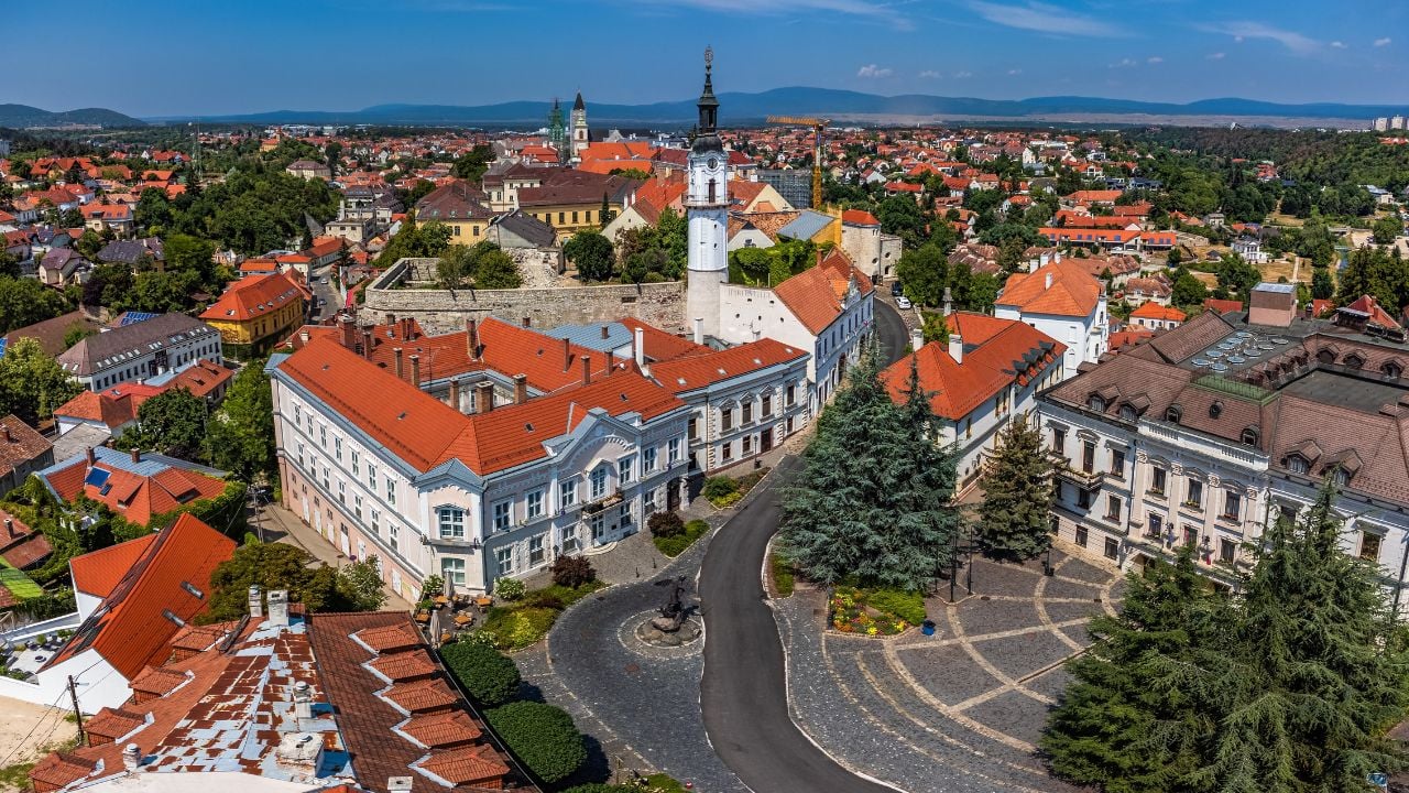 Veszprem, Hungary - Aerial panoramic view of the castle district of Veszprem with city hall building at Ovaros square and Fire-watch tower on a bright summer day with clear blue sky