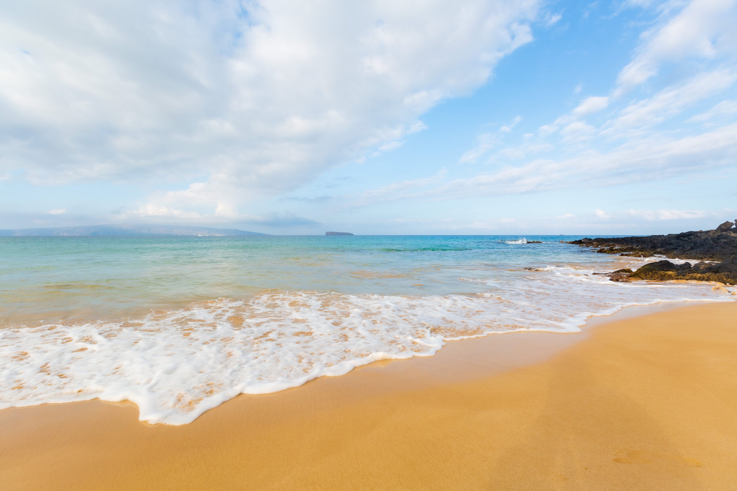 a white sand beach in maui hawaii