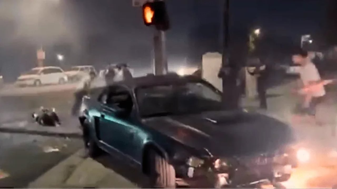 Driver runs into crowd