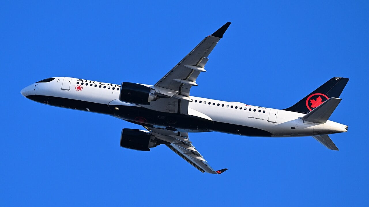 Air Canada Airbus A220-300 C-GVDQ, as flight 749 to Montreal, after departing Runway 27 at Boston.