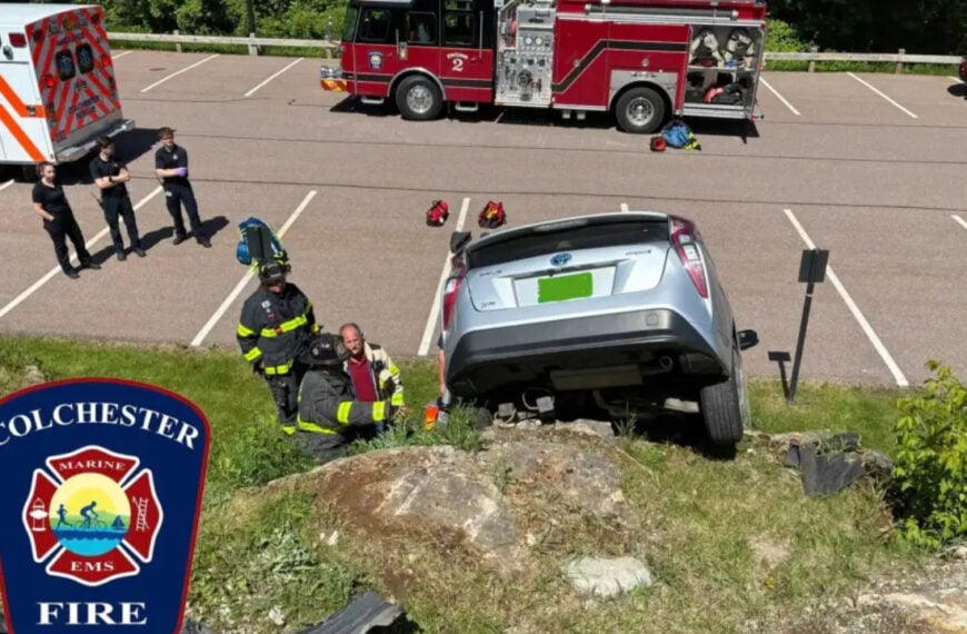 Car drives over edge of small cliff in Colchester parking lot