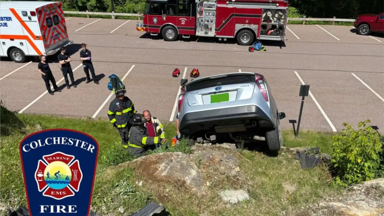 Car drives over edge of small cliff in Colchester parking lot