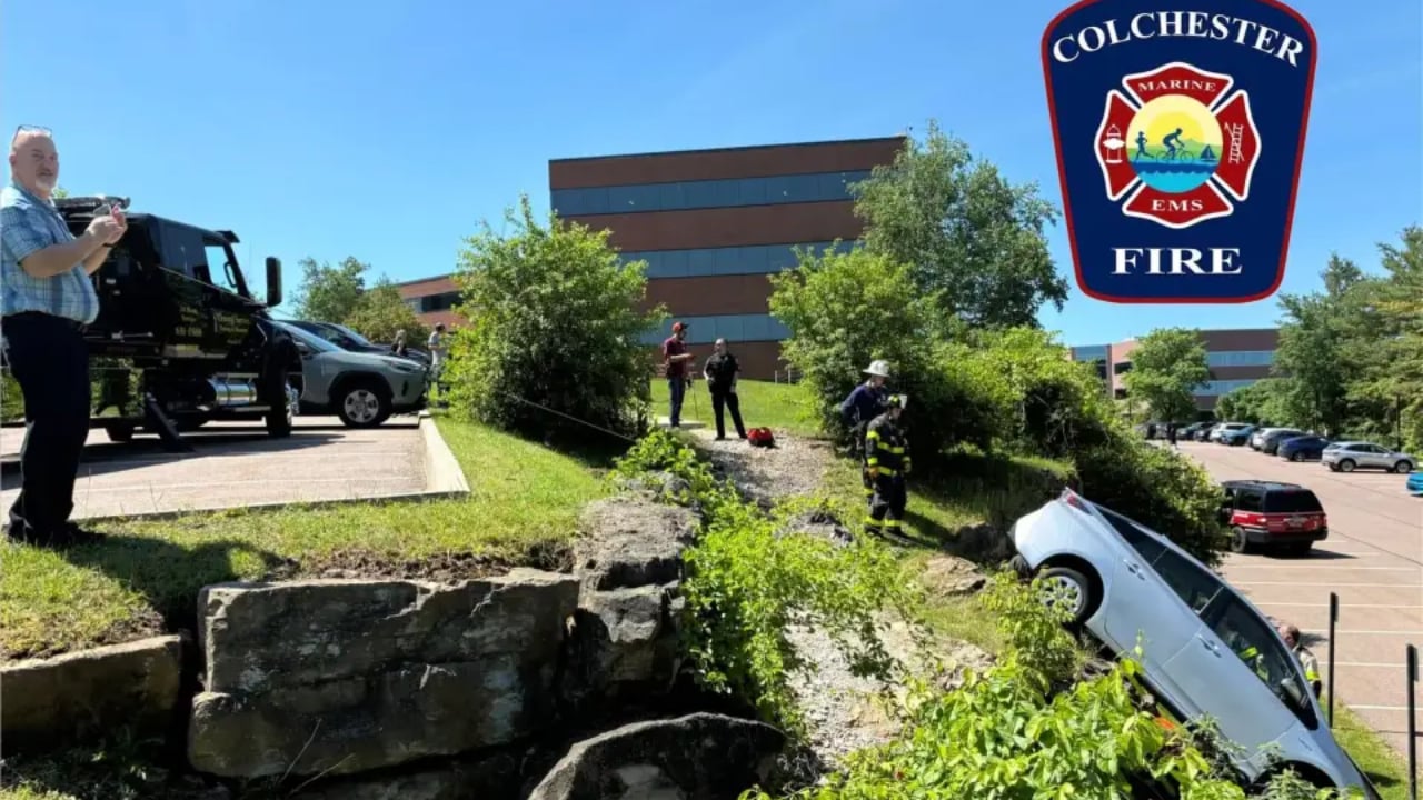Car drives over edge of small cliff in Colchester parking lot