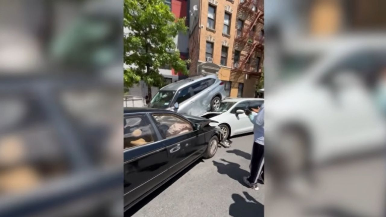 A car swerves, smashes, and flips an SUV.