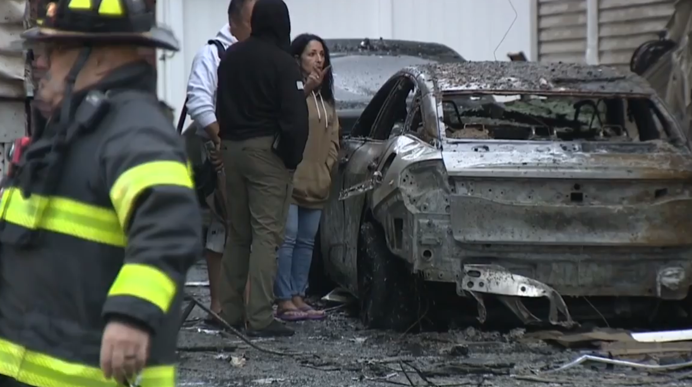 ev battery catches two homes on fire