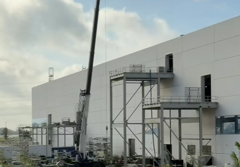 driving past gigafactory at 80 mph