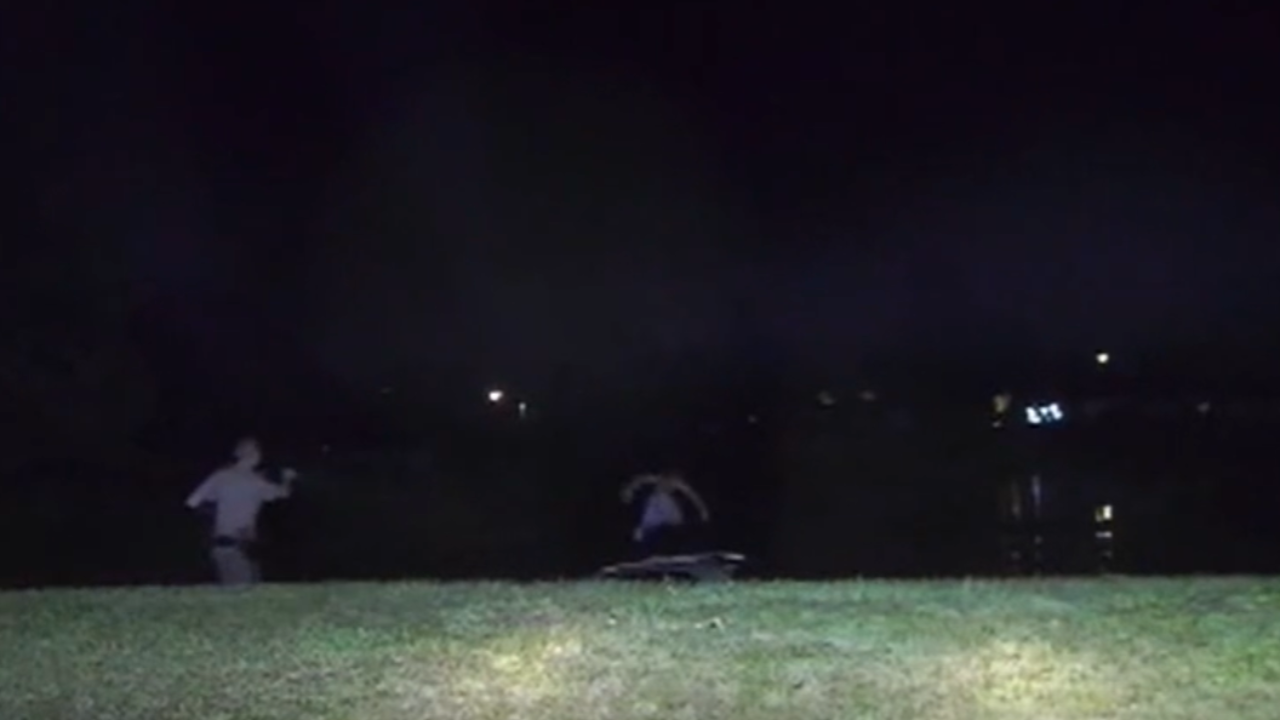 man jumps into water to avoid cops