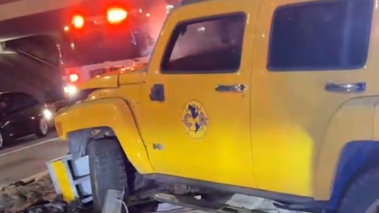 hummer hits guard rail