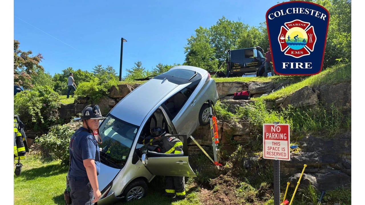 Car drives over edge of small cliff in Colchester parking lot