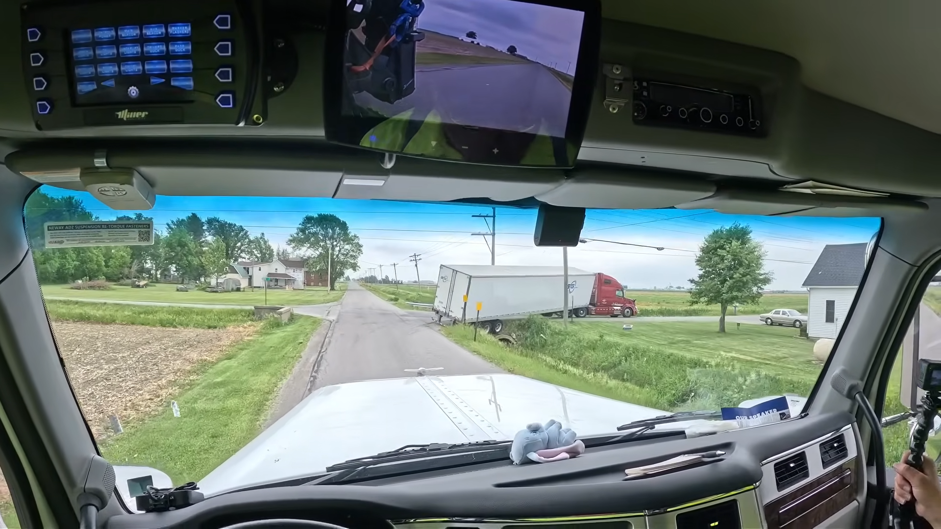semi truck stuck on back road