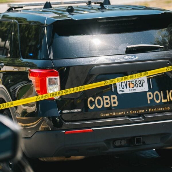 Rear angle view of a Cobb County Police Department﻿ Car with a crime scene tape