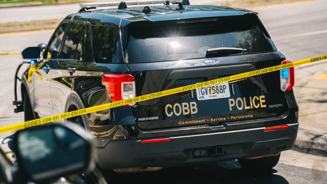 Rear angle view of a Cobb County Police Department﻿ Car with a crime scene tape