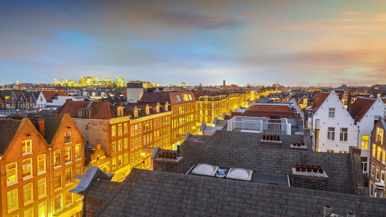 Amsterdam, Netherlands view of the cityscape from De Pijp at dusk.