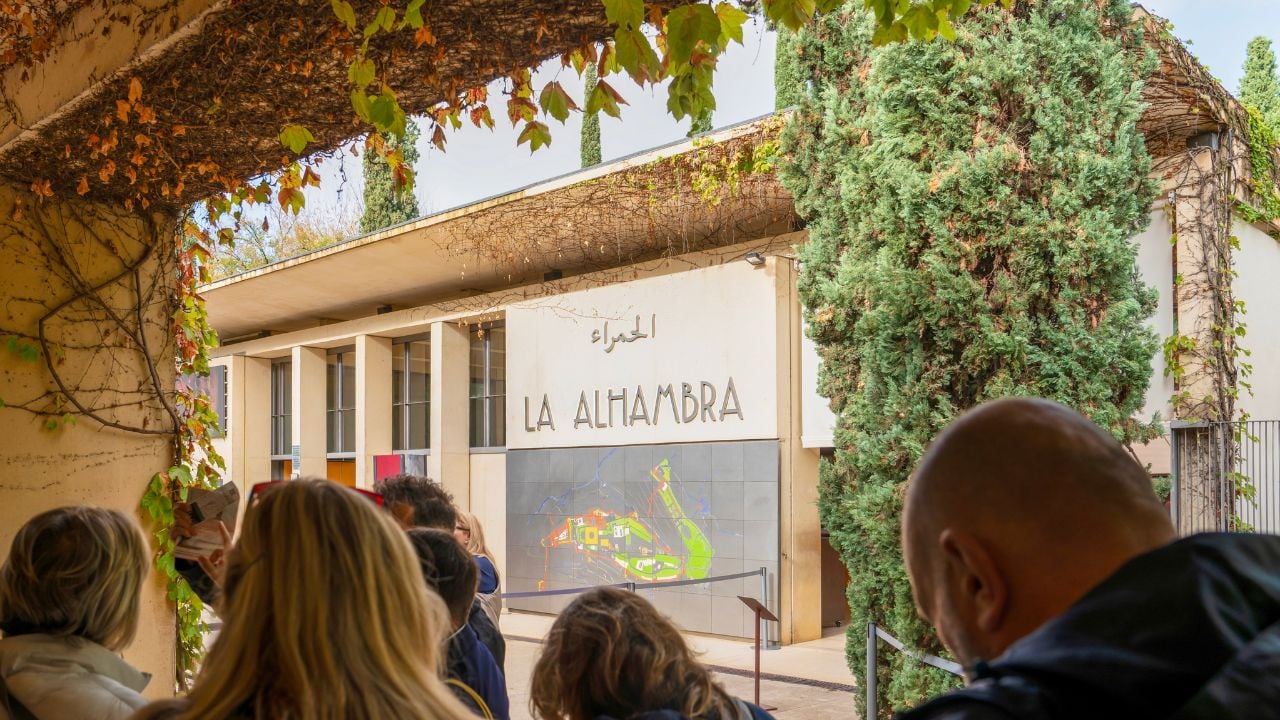 Tourists waiting near the entrance to the Alhambra in Granada, Spain