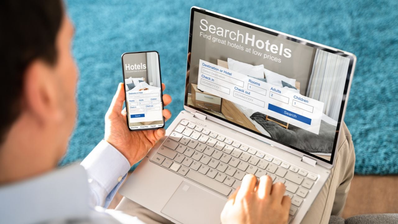 Person using a hotel booking app on a smartphone