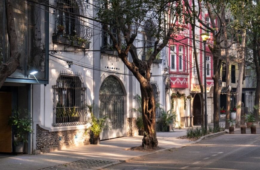 Morning light hits the facades of the art deco style buildings on a street in the trendy neighborhood of La Condesa, in Cuauhtemoc borough of Mexico City