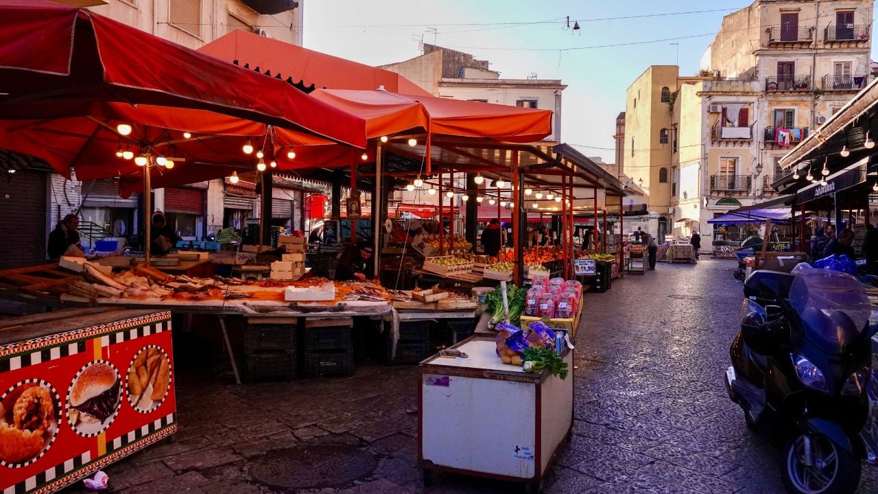 People shopping at Ballarò market in Palermo, Sicily