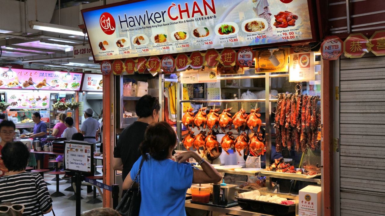 People eating at Chinatown Complex hawker center in Singapore