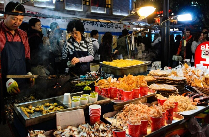 Korean street food in Seoul city, Myeong-dong Shopping Street. Seoul shopping center, night market and bazaar. Korean crackers. Seoul, South Korea - 10.31.2011.