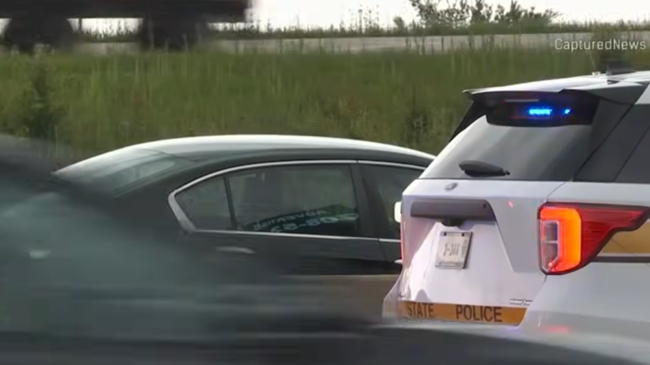 man hit while changing tire