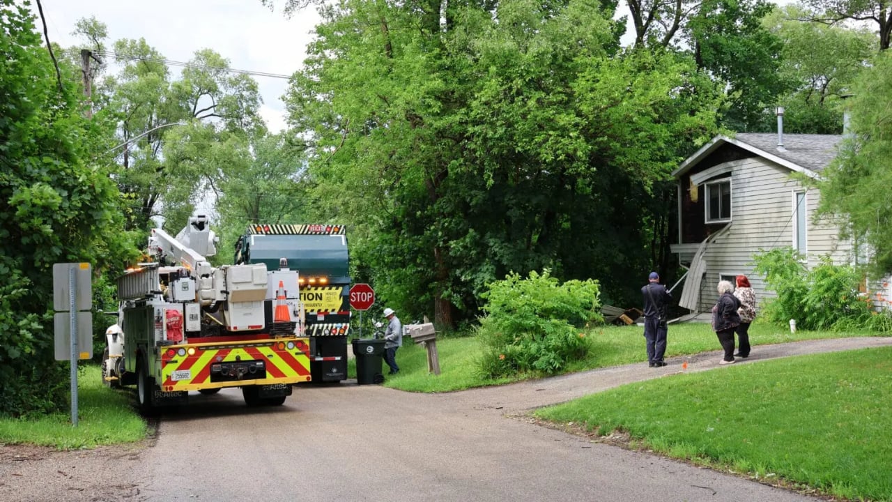 Garbage truck catches on overhead wires, trapping driver and damaging home in Ingleside