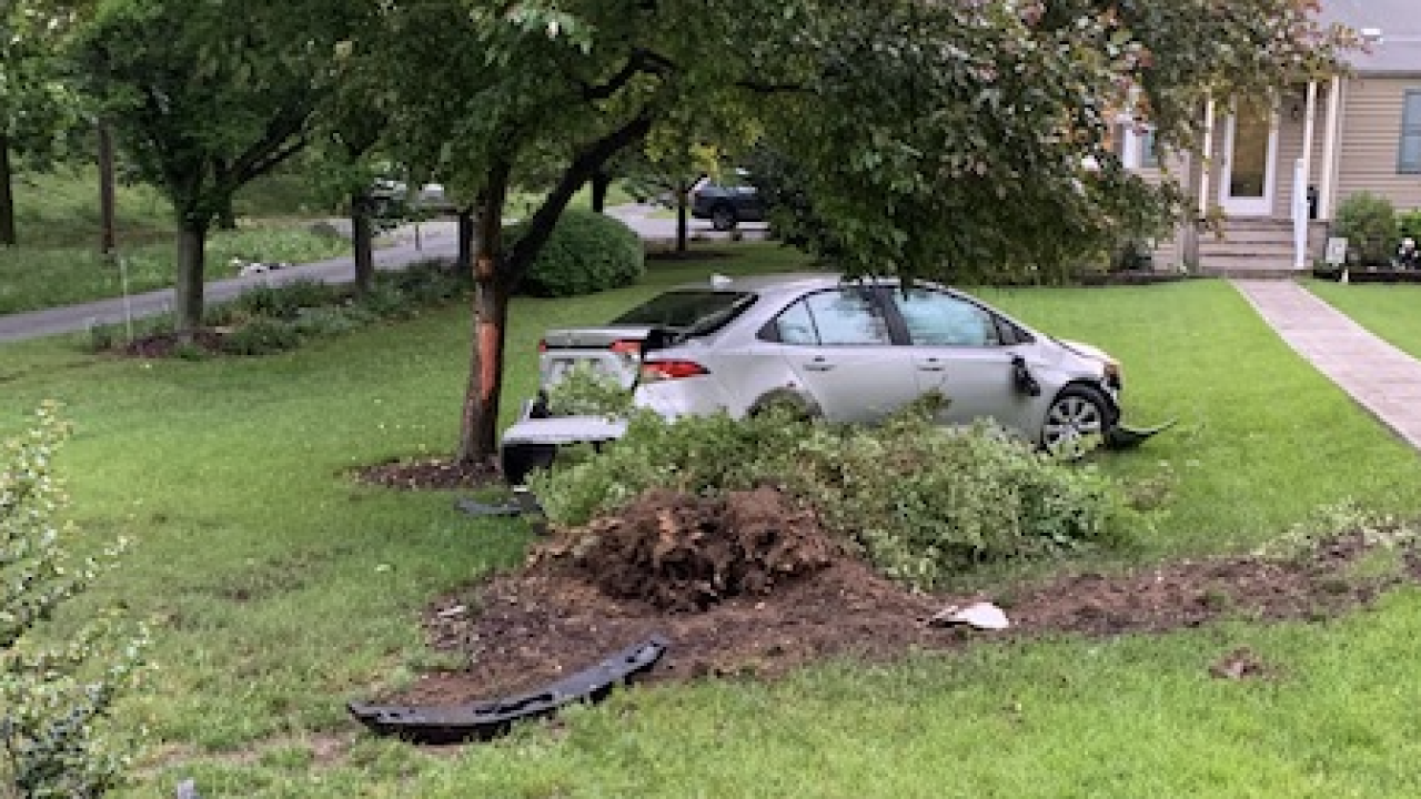 car flies into yard