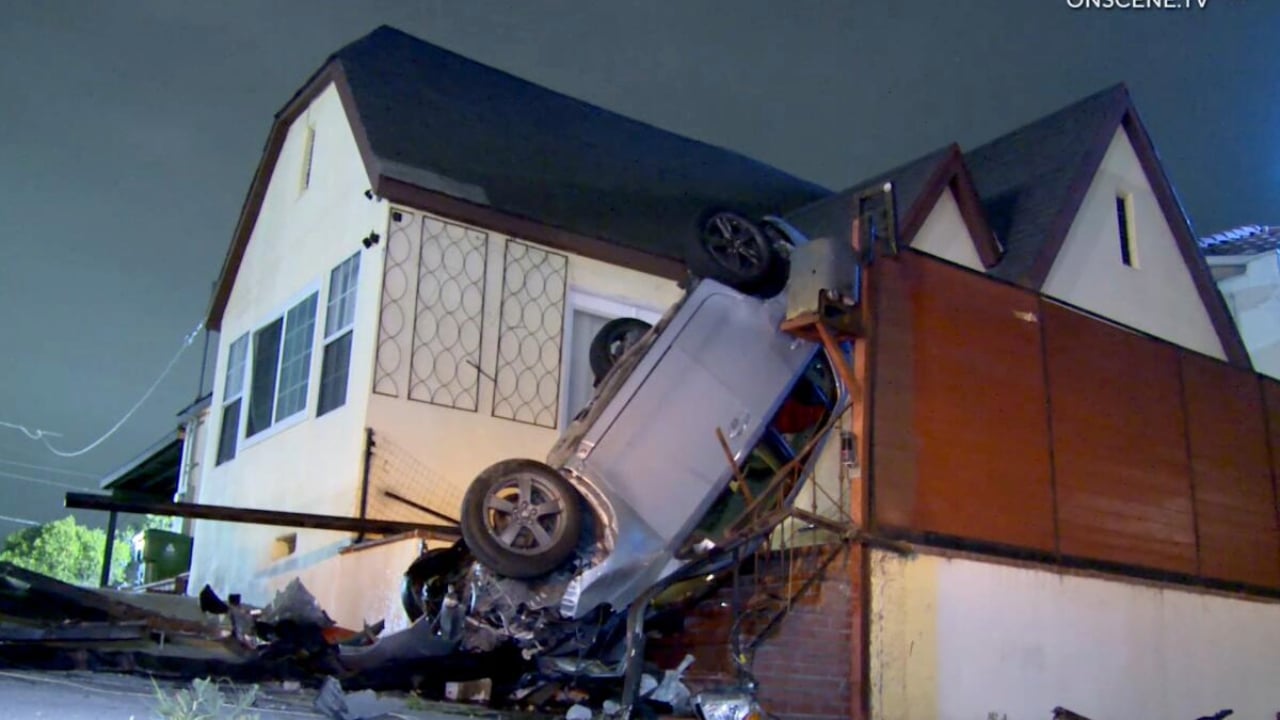 Car on porch of Wilmington home