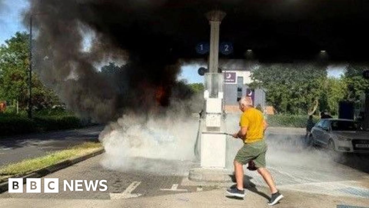 Car in flames at petrol station
