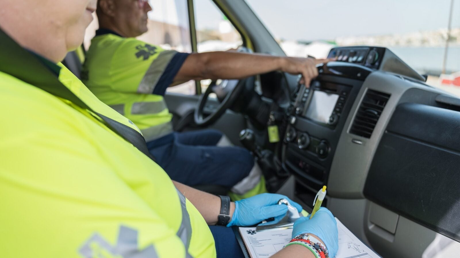 two paramedics in car