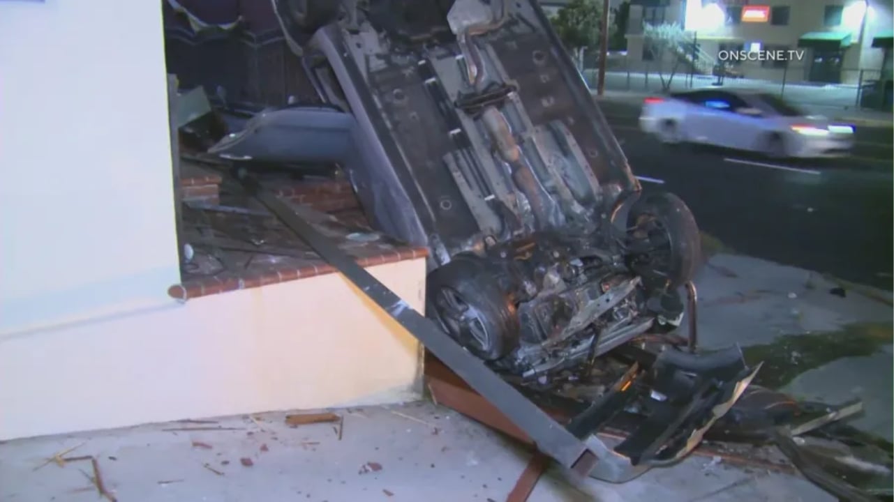 Car on porch of Wilmington home