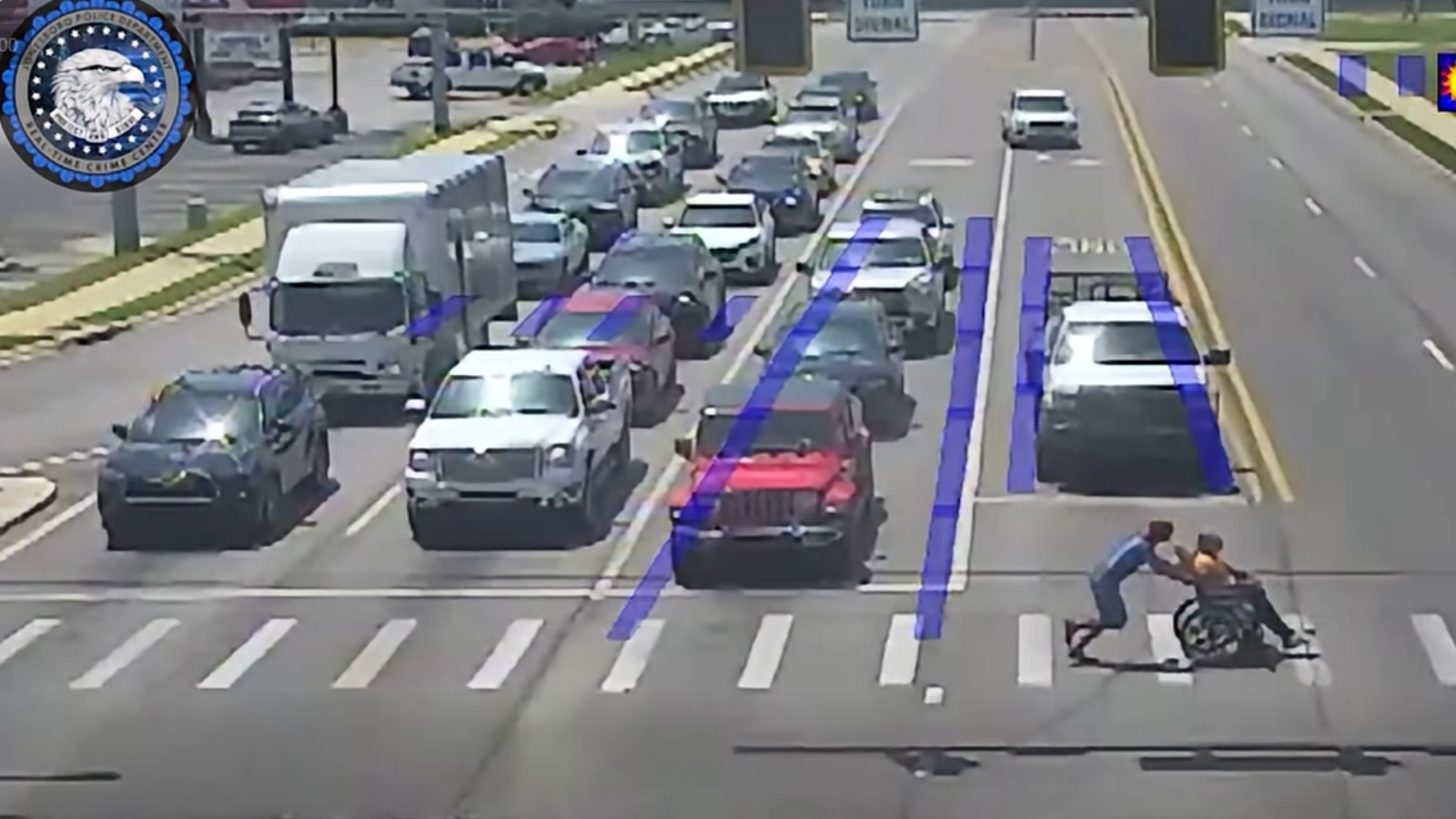 Driver Dressed as Spider-Man Pulls Over to Help Man in Wheelchair Cross Busy Street
