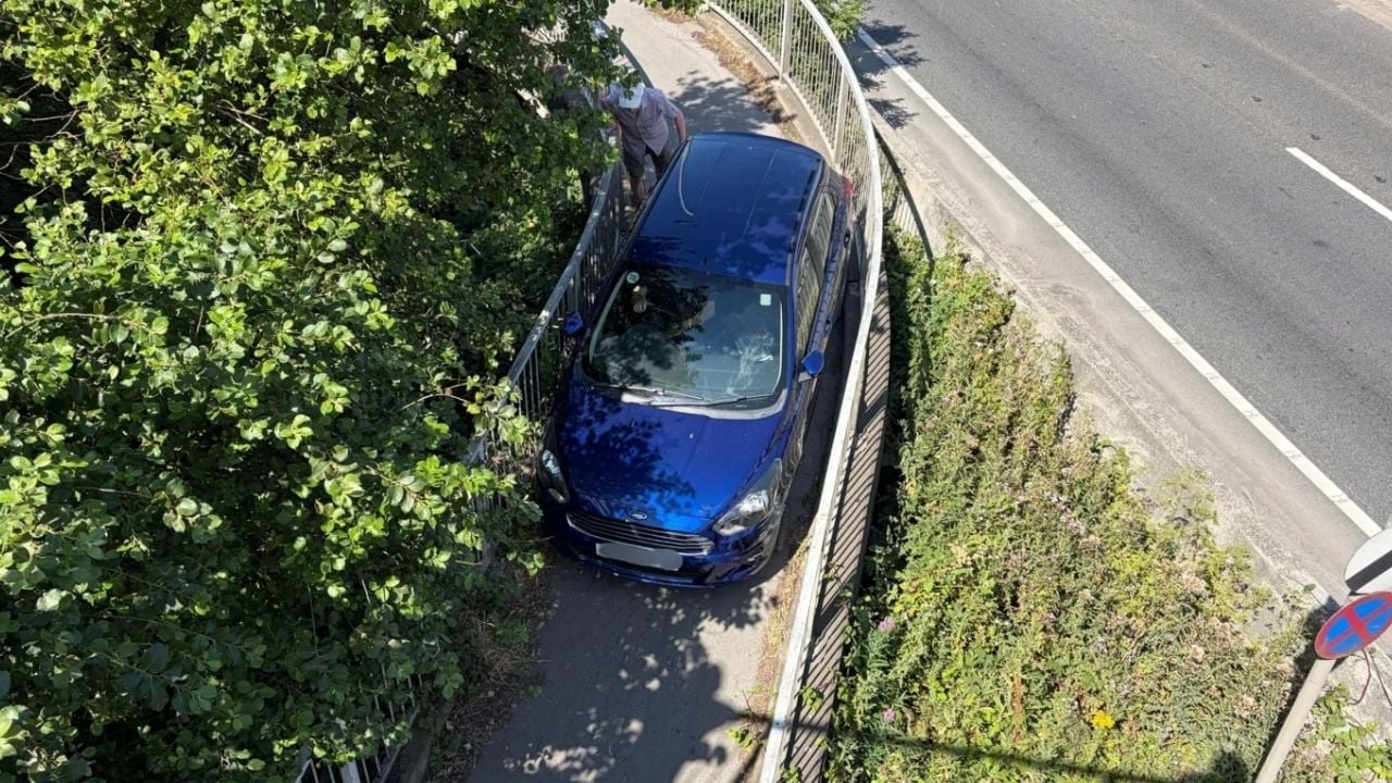 Ford stuck on footbridge overhead