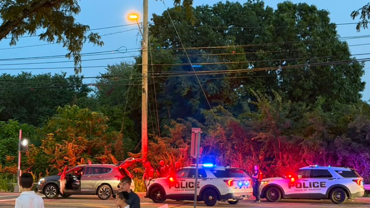 Multiple Ramapo Police Department vehicles surround a stopped SUV following an alleged road rage incident in Montebello, New York.