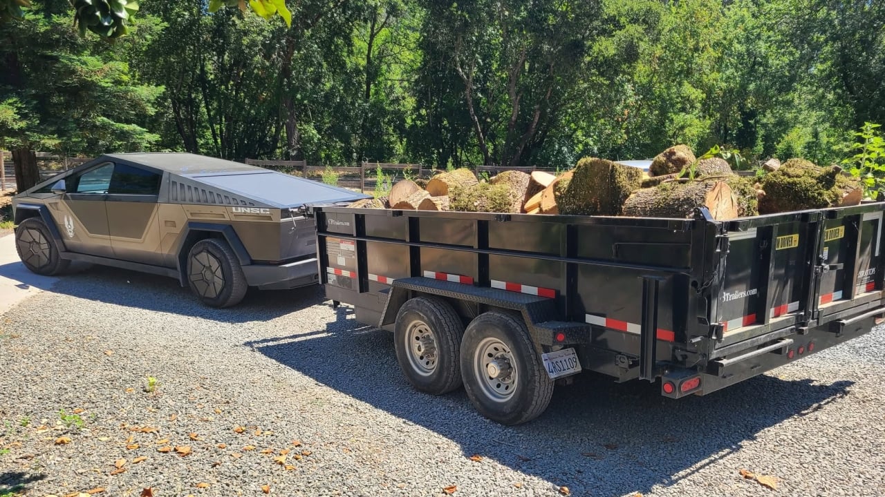 Tesla Cybertruck Towing Wood Rear View
