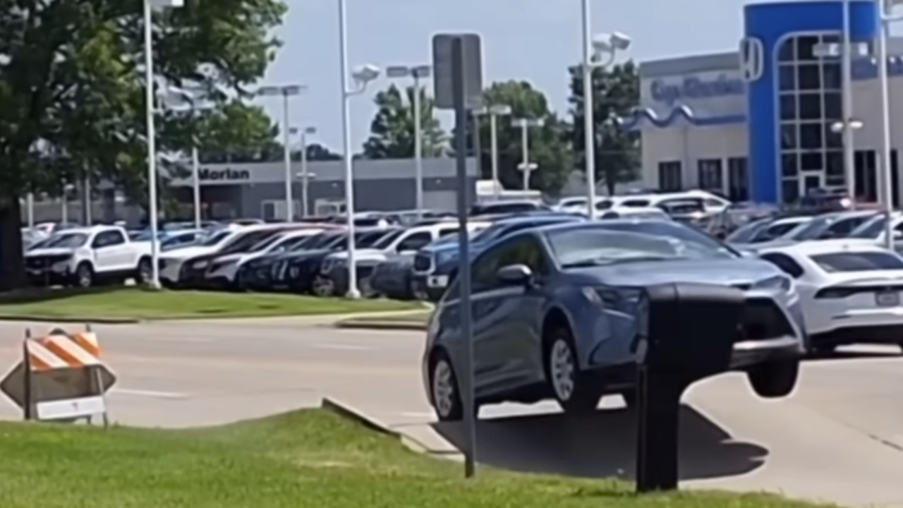 buckling road sends car flying