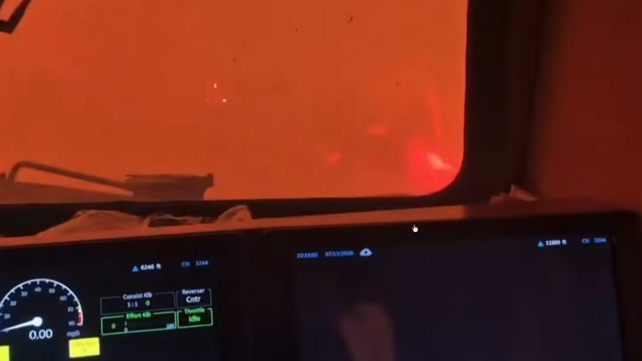 canadian train surrounded by wildfire