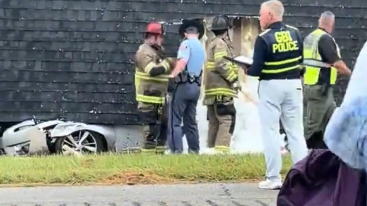 house crushes car on highway