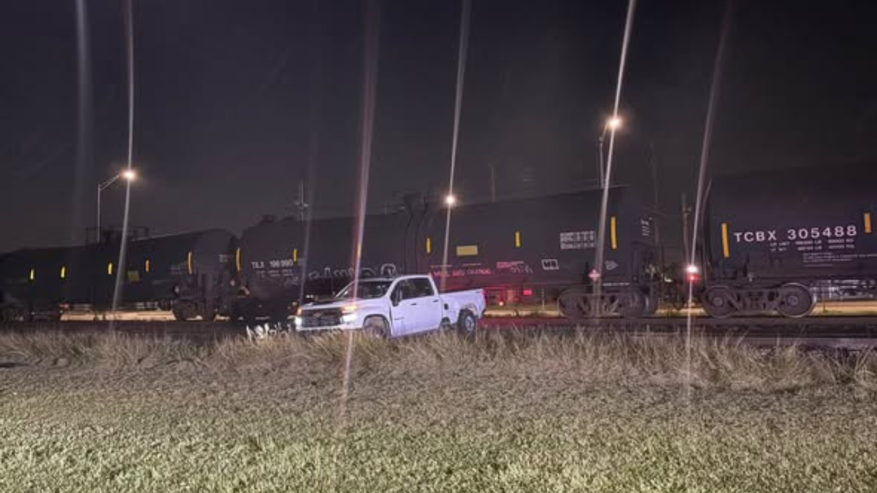 truck stuck on train tracks