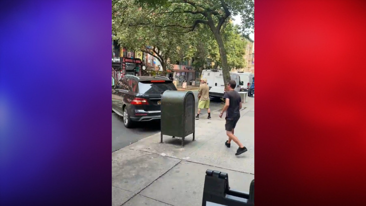 man hits mercedes with skateboard in street brawl