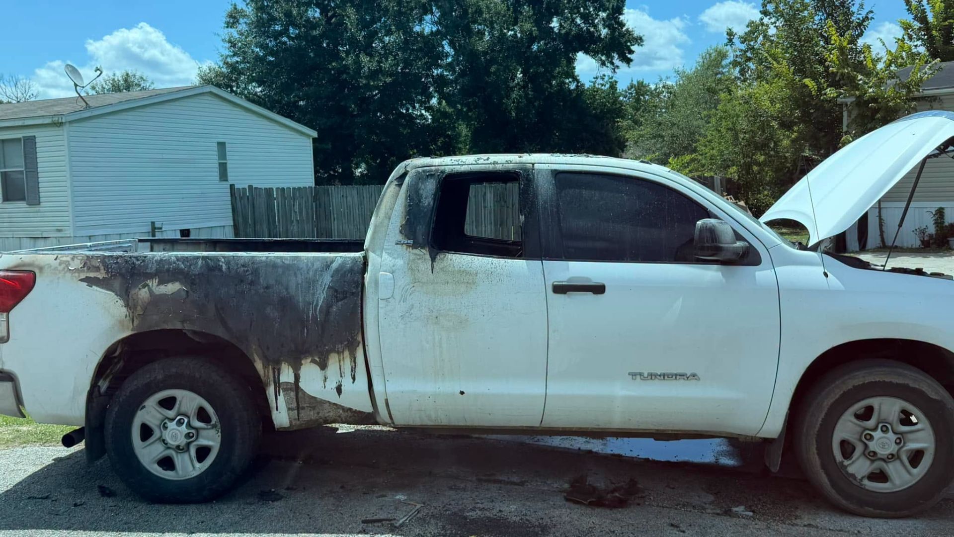 Toyota Tundra destroyed after fireworks debris cause fire in the truck bed.