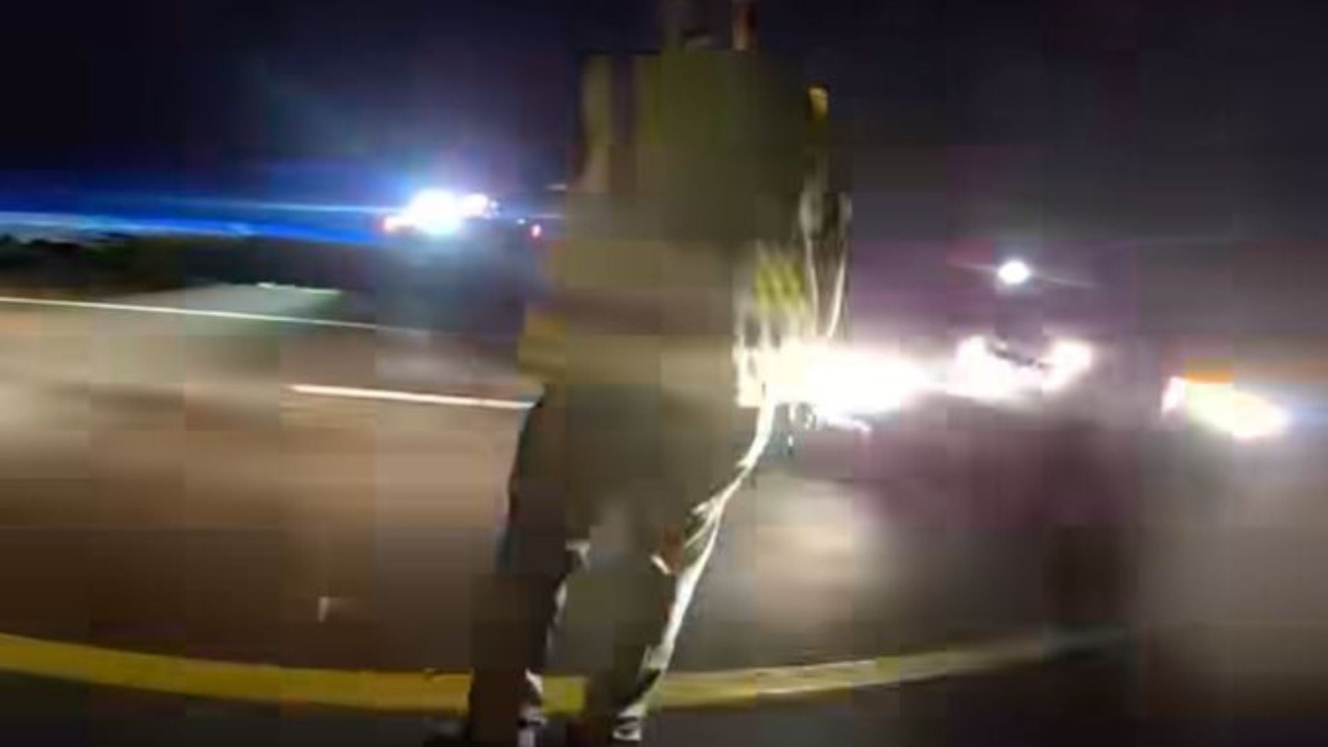 Officers escape injury after passing car slams into police patrol vehicle during roadside stop.